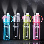 Leakproof water bottle with built-in mist spray and carry handle on white background