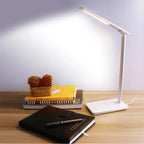 LED folding desk lamp with wireless charging for Huawei & Apple devices, adjustable color temperature, and touch control functionality