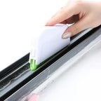 Green gap cleaning brush designed for window grooves, sliding door tracks, and tight corners

