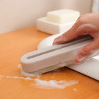 Pink squeegee designed for quick and efficient sink and shower cleaning.