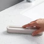 Efficient shower glass cleaner tool with soft silicone blade.