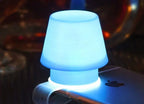 Soft warm light illuminating room from silicone mobile holder lamp