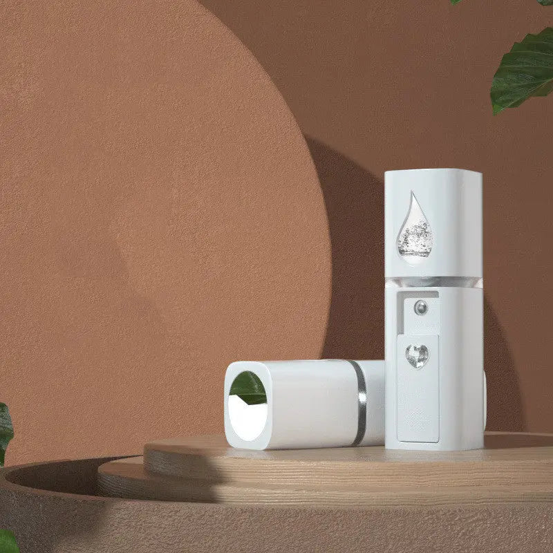 Close-up of facial moisturizer humidifier showing the cold spray mist and 3 gear settings

