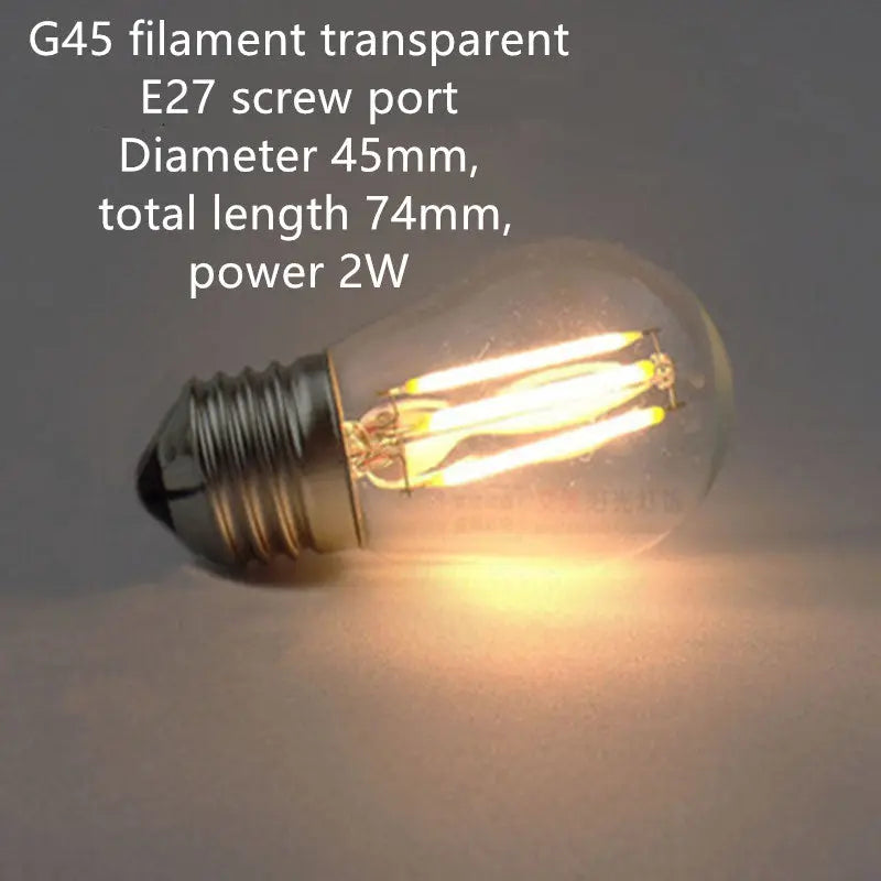 Retro Edison filament bulb with transparent glass and dimmable feature, available in various shapes like ST64, A19, G80 for vintage home lighting