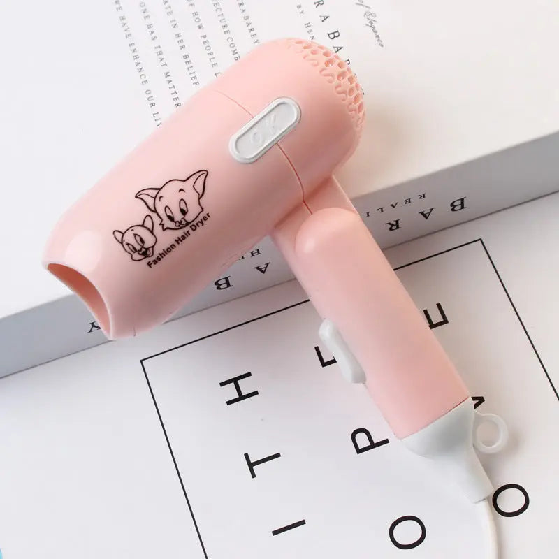 Pink handheld hair dryer with cartoon character on a white background