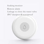 Wireless water sensor placed on bathroom floor with real-time app alerts