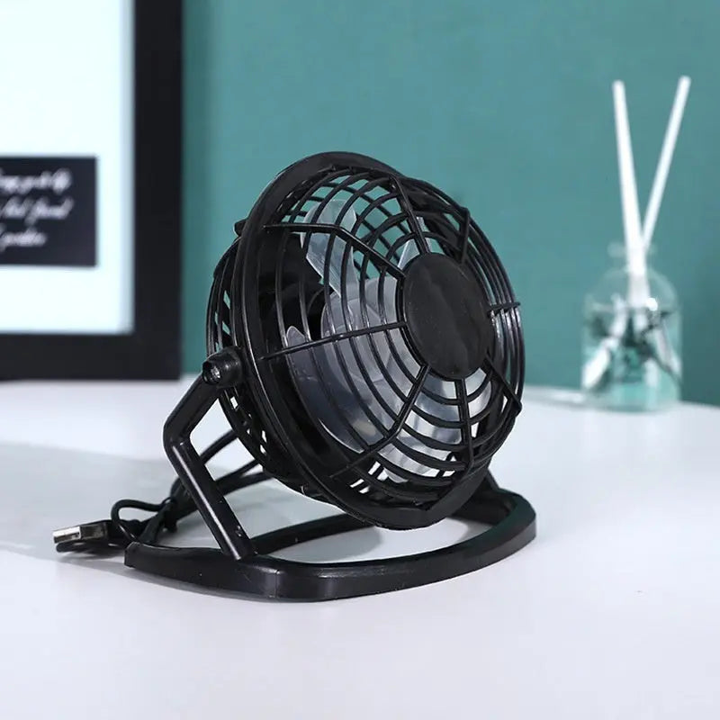 Mini 4-inch USB electric fan in pink, blue, and black with two-speed settings – quiet desktop cooling fan for home or office

