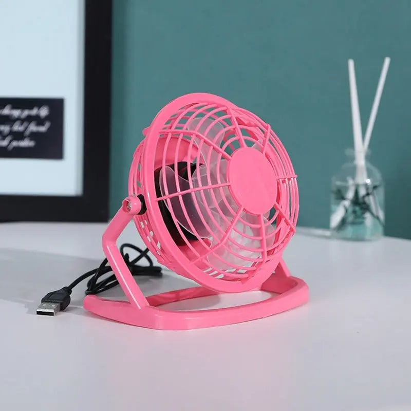 Mini 4-inch USB electric fan in pink, blue, and black with two-speed settings – quiet desktop cooling fan for home or office

