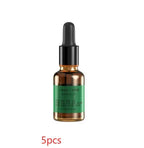 Bottle with dropper and green label on a white background- Creative candle light-style aroma diffuser in beige and black with 120ml tank – USB-powered for home aromatherapy and humidification