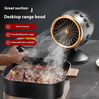 Portable small kitchen ventilator in black gold with filter element, USB-powered desktop smoke extractor fan