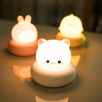 LED bedside desk lamp with cute pet designs (rabbit, kitten, duckling, bear), tap-controlled light, and modern style for home decoration