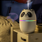 Mini USB essential oil humidifier in white, pink, and green with night light and cute pet design for desktop or bedroom use